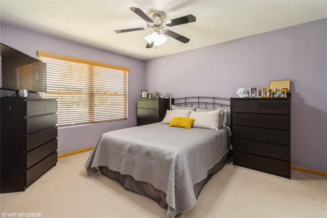 200 Walnut Dr NW, Bondurant, IA 50035 - bedroom with light colored carpet and ceiling fan