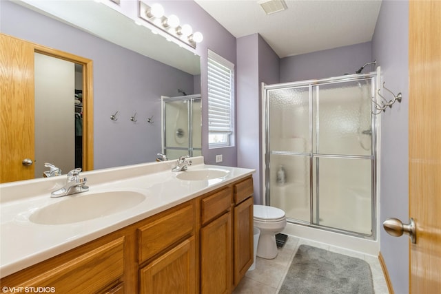 200 Walnut Dr NW, Bondurant, IA 50035 - bathroom with a stall shower, double vanity, and tile patterned floors
