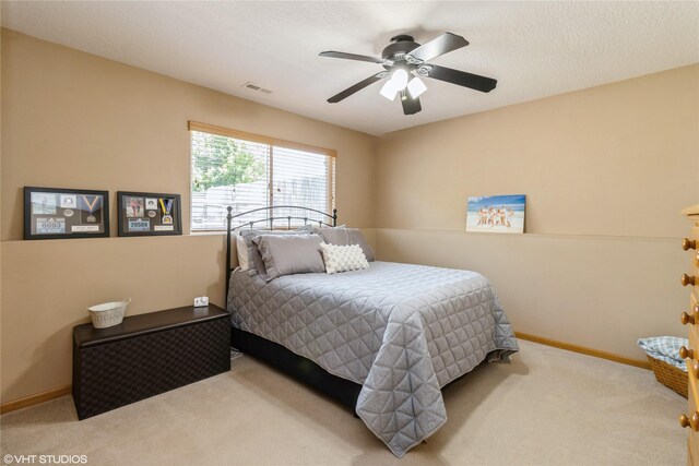 200 Walnut Dr NW, Bondurant, IA 50035 - bedroom with carpet floors and a ceiling fan