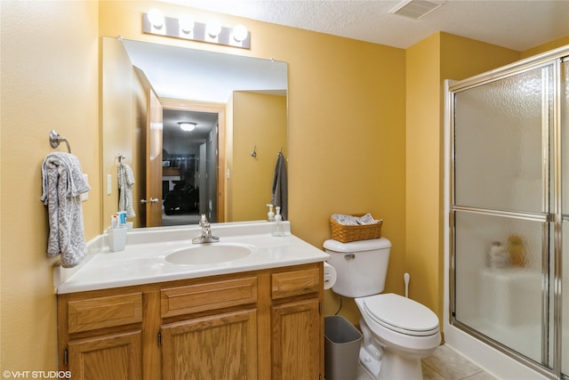200 Walnut Dr NW, Bondurant, IA 50035 - bathroom featuring vanity, a shower stall, tile patterned floors, and a textured ceiling
