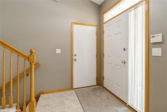200 Walnut Dr NW, Bondurant, IA 50035 - foyer with stairway and light tile patterned flooring