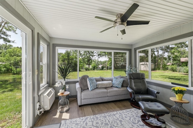 4200 SW 23rd Pl, Des Moines, IA 50321 - sunroom / solarium with a ceiling fan, wood finished floors, and a wall unit AC