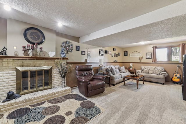 4200 SW 23rd Pl, Des Moines, IA 50321 - living area with a textured ceiling, a fireplace, and carpet