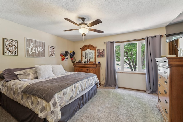 4200 SW 23rd Pl, Des Moines, IA 50321 - carpeted bedroom with a textured ceiling and ceiling fan