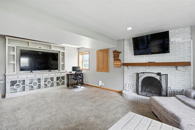 6843 NW 5th St, Des Moines, IA 50313 - living room with carpet flooring, a fireplace, an office area, a textured ceiling, and recessed lighting