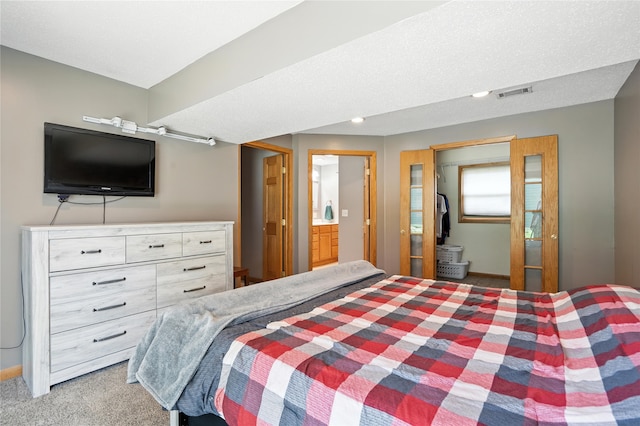 6843 NW 5th St, Des Moines, IA 50313 - bedroom with carpet and connected bathroom
