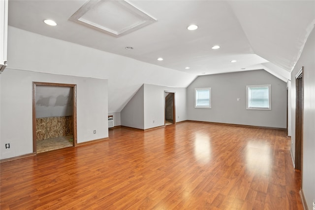 6843 NW 5th St, Des Moines, IA 50313 - additional living space featuring attic access, light wood finished floors, vaulted ceiling, and recessed lighting