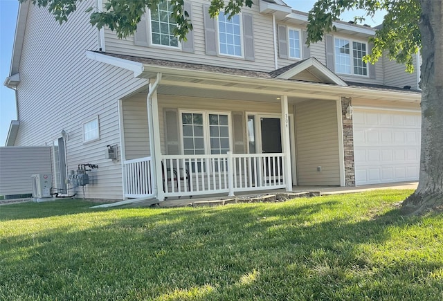 2101 Meadow Ct Unit 304, Des Moines, IA 50320 - view of front facade featuring covered porch, an attached garage, and a front yard