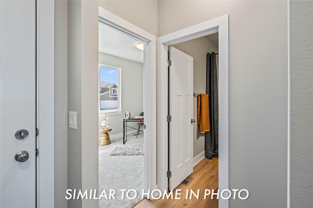 1488 S 91st St, West Des Moines, IA 50266 - hall featuring a desk and wood finished floors