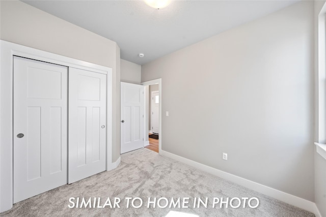 1488 S 91st St, West Des Moines, IA 50266 - unfurnished bedroom featuring carpet and a closet