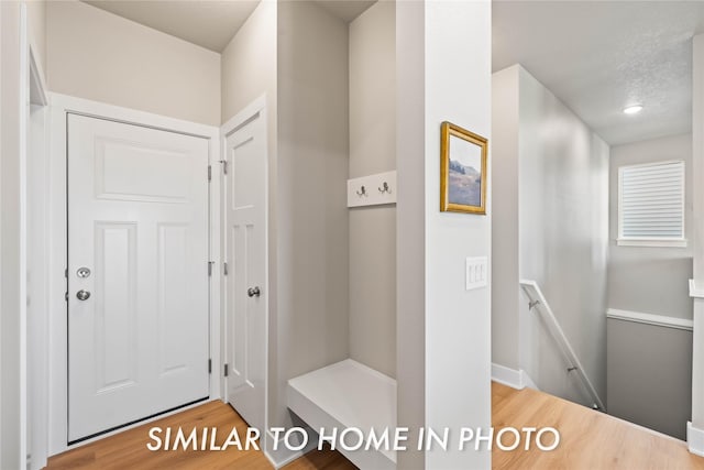 1488 S 91st St, West Des Moines, IA 50266 - hall featuring an upstairs landing and wood finished floors