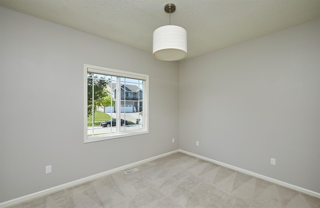 9305 Sugar Creek Cir, West Des Moines, IA 50266 - spare room with light colored carpet and a textured ceiling