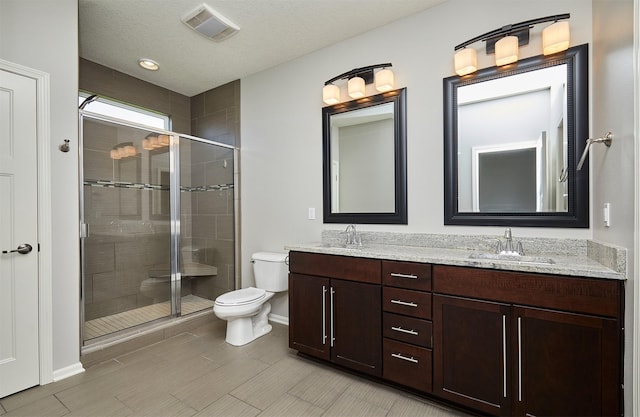 9305 Sugar Creek Cir, West Des Moines, IA 50266 - bathroom with double vanity and a shower stall