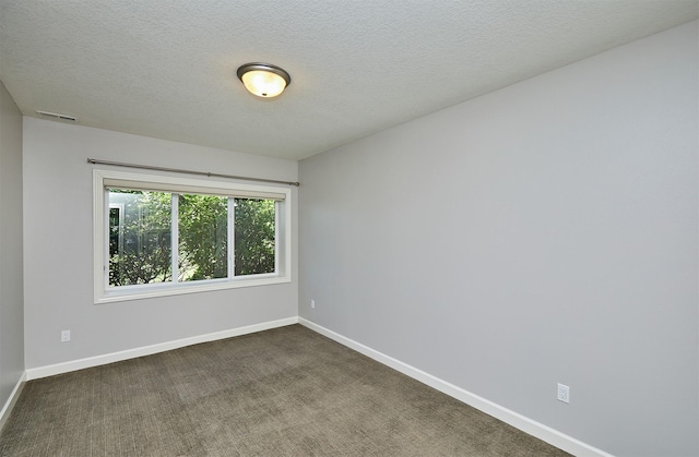 9305 Sugar Creek Cir, West Des Moines, IA 50266 - spare room featuring dark colored carpet and a textured ceiling