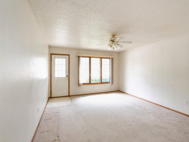345 13th Ave SW Unit 17, Altoona, IA 50009 - carpeted empty room featuring a ceiling fan and a textured ceiling
