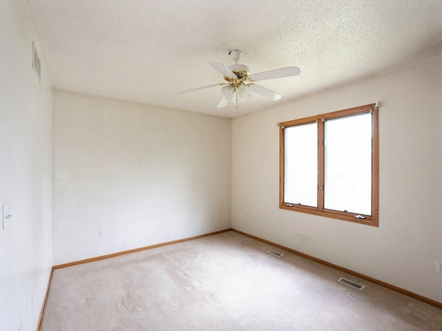 345 13th Ave SW Unit 17, Altoona, IA 50009 - carpeted spare room featuring ceiling fan and a textured ceiling