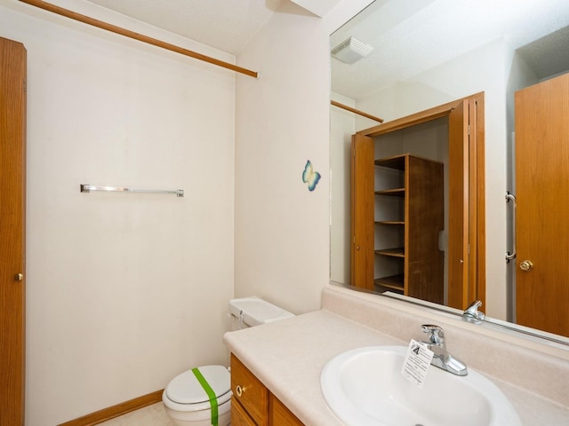 345 13th Ave SW Unit 17, Altoona, IA 50009 - bathroom featuring toilet and vanity
