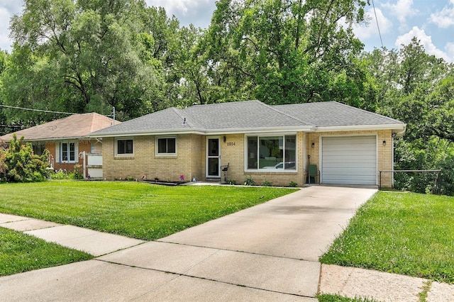 2904 Shadyoak Dr, Des Moines, IA 50310 - ranch-style home featuring driveway, a garage, brick siding, a front yard, and a shingled roof