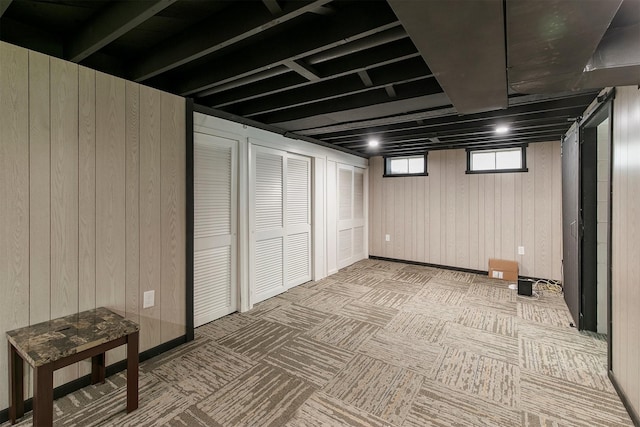 2904 Shadyoak Dr, Des Moines, IA 50310 - basement featuring carpet flooring and wooden walls