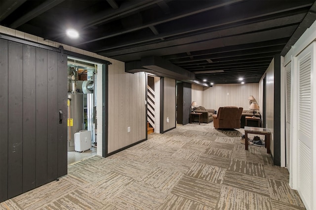 2904 Shadyoak Dr, Des Moines, IA 50310 - finished basement featuring stairs, gas water heater, carpet floors, and wood walls