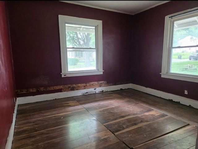 2127 E 13th St, Des Moines, IA 50316 - unfurnished room featuring ornamental molding and wood-type flooring