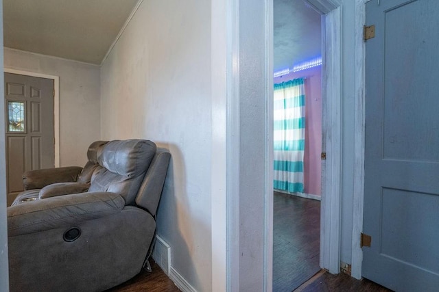 310 E 19th St S, Newton, IA 50208 - sitting room featuring dark wood finished floors and ornamental molding