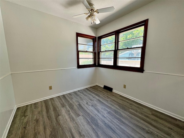 4425 Amick Ave, Des Moines, IA 50310 - unfurnished room with dark wood finished floors and ceiling fan