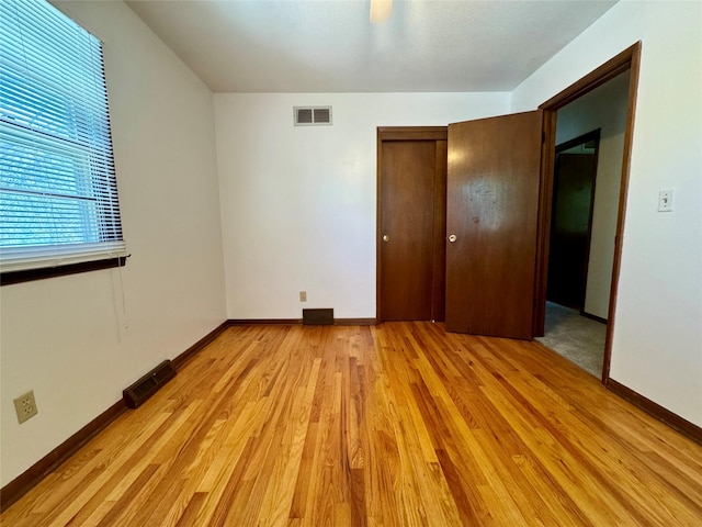 4425 Amick Ave, Des Moines, IA 50310 - unfurnished bedroom featuring light wood-style flooring and a closet