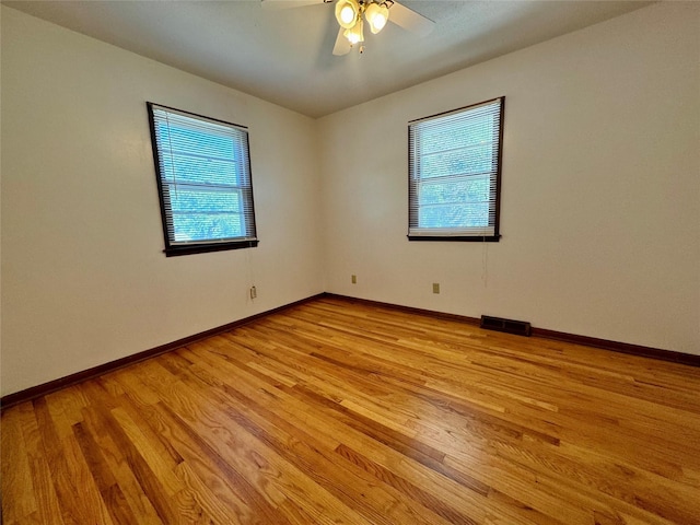 4425 Amick Ave, Des Moines, IA 50310 - spare room featuring light wood-type flooring and ceiling fan