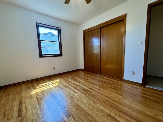 4425 Amick Ave, Des Moines, IA 50310 - unfurnished bedroom featuring light wood-style flooring, a closet, and ceiling fan