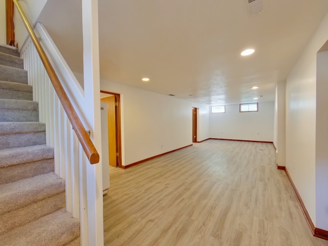 4425 Amick Ave, Des Moines, IA 50310 - below grade area with stairway, light wood-type flooring, and recessed lighting