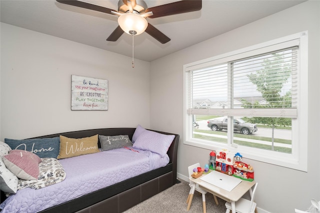 1165 Locust St, Waukee, IA 50263 - bedroom featuring multiple windows, carpet, and a ceiling fan