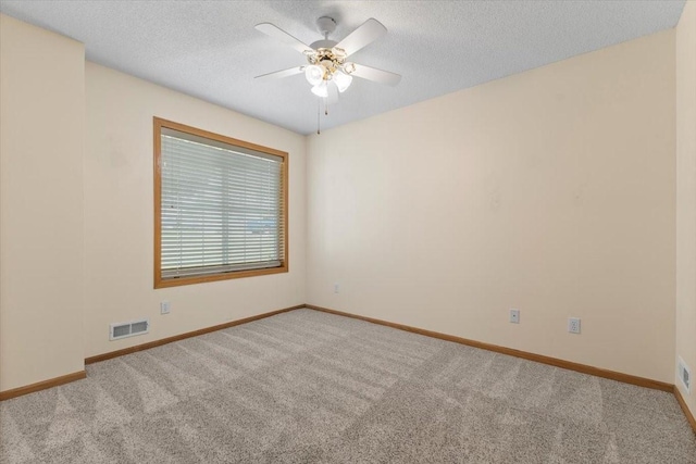 130 NW Georgetown Blvd Unit 4, Ankeny, IA 50023 - carpeted empty room featuring a textured ceiling and a ceiling fan