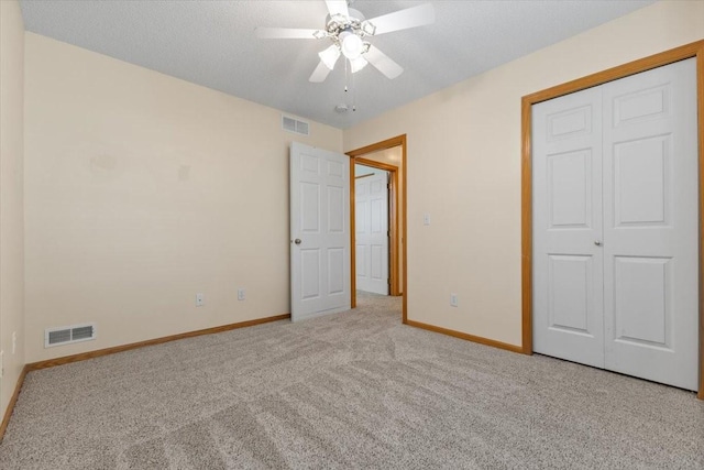 130 NW Georgetown Blvd Unit 4, Ankeny, IA 50023 - unfurnished bedroom featuring carpet floors, a closet, and ceiling fan