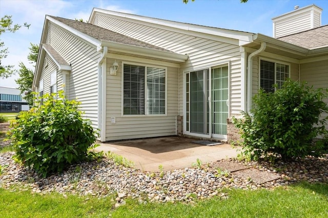 130 NW Georgetown Blvd Unit 4, Ankeny, IA 50023 - back of house featuring a patio area and roof with shingles