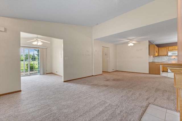 130 NW Georgetown Blvd Unit 4, Ankeny, IA 50023 - unfurnished living room with a ceiling fan and light carpet