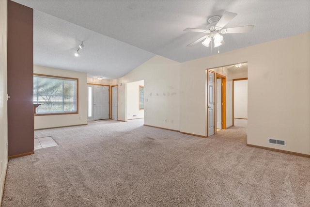 130 NW Georgetown Blvd Unit 4, Ankeny, IA 50023 - unfurnished room featuring carpet floors, lofted ceiling, and a ceiling fan