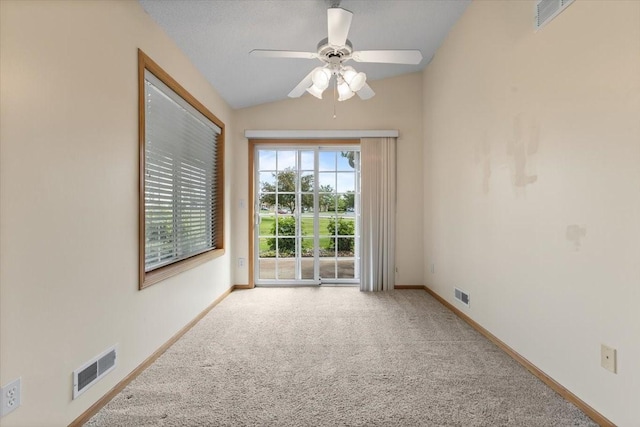 130 NW Georgetown Blvd Unit 4, Ankeny, IA 50023 - empty room featuring carpet flooring, a ceiling fan, and vaulted ceiling