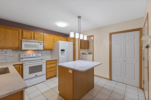 130 NW Georgetown Blvd Unit 4, Ankeny, IA 50023 - kitchen featuring white appliances, separate washer and dryer, light countertops, tasteful backsplash, and light tile patterned floors