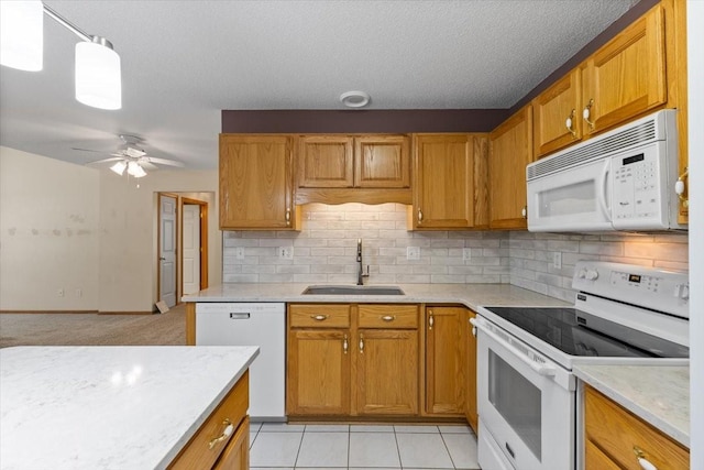 130 NW Georgetown Blvd Unit 4, Ankeny, IA 50023 - kitchen with white appliances, backsplash, ceiling fan, and brown cabinetry