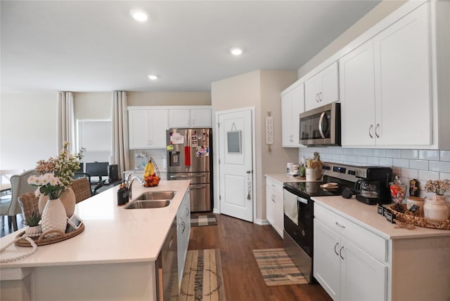 70 Prairie Bluff Dr, Waukee, IA 50263 - kitchen featuring appliances with stainless steel finishes, decorative backsplash, light countertops, white cabinetry, and recessed lighting