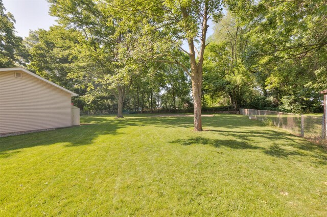 1808 Payton Ave, Des Moines, IA 50315 - fenced yard with view of scattered trees