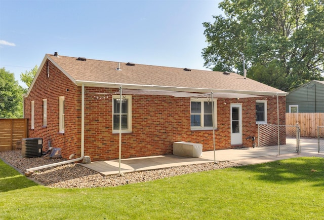 1808 Payton Ave, Des Moines, IA 50315 - rear view of house with brick siding, a patio area, and a shingled roof
