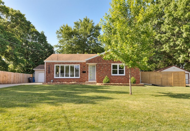 1808 Payton Ave, Des Moines, IA 50315 - view of front of property featuring brick siding, a garage, and a shingled roof