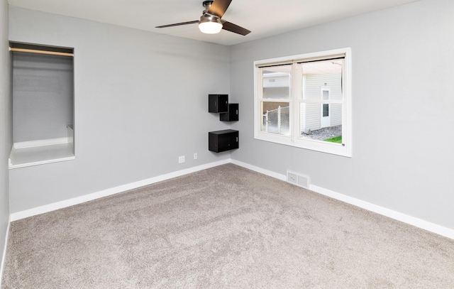 1808 Payton Ave, Des Moines, IA 50315 - empty room with carpet flooring and ceiling fan