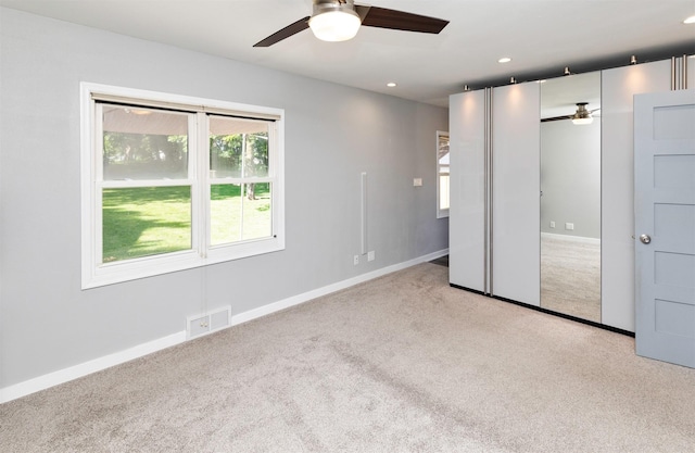 1808 Payton Ave, Des Moines, IA 50315 - unfurnished bedroom featuring carpet flooring, recessed lighting, a closet, and ceiling fan