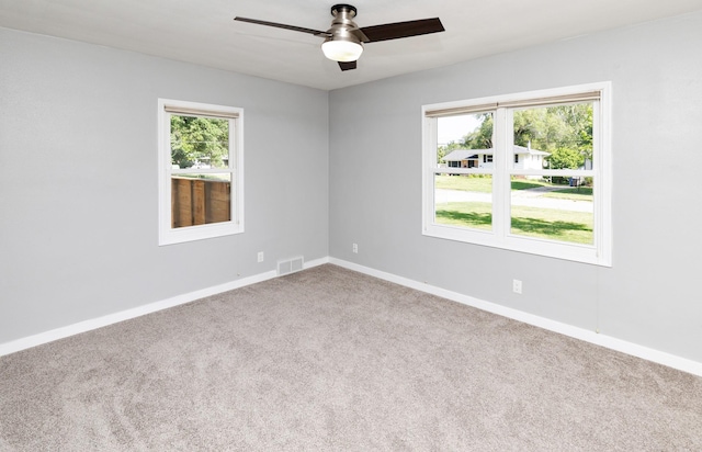 1808 Payton Ave, Des Moines, IA 50315 - carpeted spare room featuring a ceiling fan and baseboards