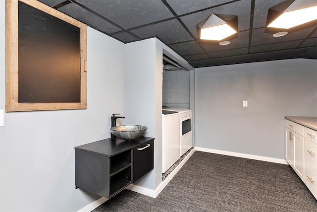 1808 Payton Ave, Des Moines, IA 50315 - finished basement featuring washer and clothes dryer, dark carpet, and a drop ceiling