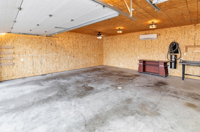 1808 Payton Ave, Des Moines, IA 50315 - garage featuring a wall mounted AC and wooden walls