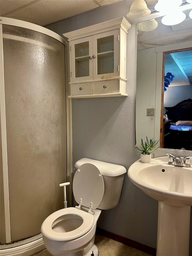 3521 SE 20th St, Des Moines, IA 50320 - full bathroom featuring a stall shower and a textured wall
